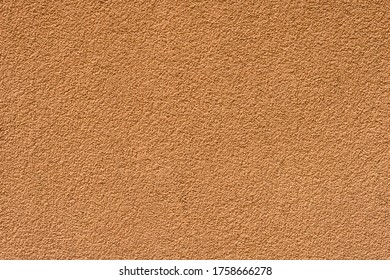 Decorative Silicone Plaster Texture Background. Orange Exterior Facade Wall Finish 