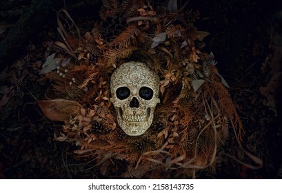 Decorative skull and dry autumn leaves on dark natural background. symbol of Halloween holiday, samhain sabbat. magic esoteric ritual. Mysticism, wicca, occultism, Witchcraft concept. flat lay - Shutterstock ID 2158143735