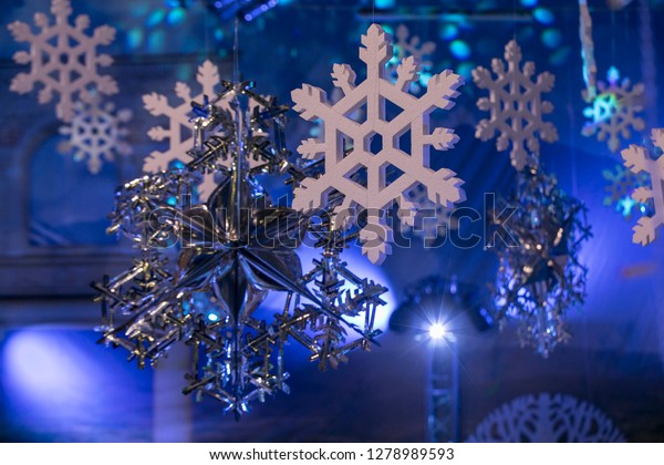 Decorative Snowflakes Hanging Under Ceiling Stock Photo