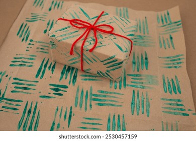 Decorative stamps tutorial using a fork and paint to create unique wrapping paper. DIY crafting project on paper for personalized designs. Fun Christmas activity for kids, creative holiday project - Powered by Shutterstock - Get 15% off with code: PIKWIZARD15