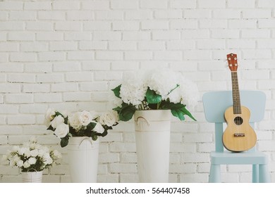 Decorative With Ukulele And Vintage Flowers Vase In Living Room (high Key Style)