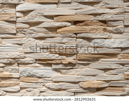 Decorative wall panels replicating brick stone and tile finishes arranged in a building store section emphasizing practical and aesthetic renovation tools