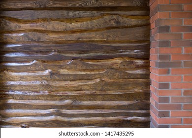 Decorative Wall Of Pine Boards Painted With Varnish. Wood Texture. Brick Column.