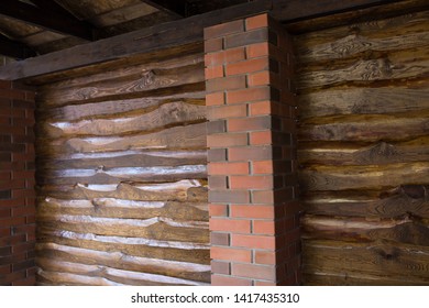 Decorative Wall Of Pine Boards Painted With Varnish. Wood Texture. Brick Column.