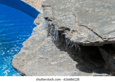 Decorative waterfall in a pool.