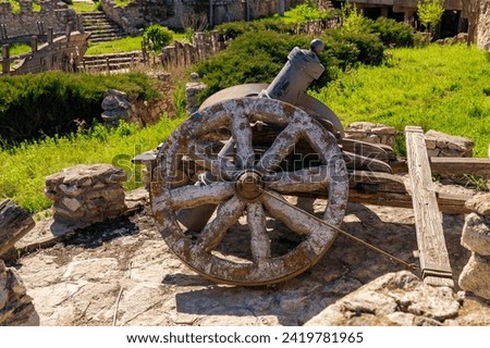 Decorative wheel, rustic symbol of progress. Background with selective focus and copy space for text