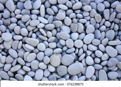 decorative white stones , round stones on white background , Stones or Gravel for building, floor or wall. Seamless Texture. pebbles isolated on a white background samana dominican republic
