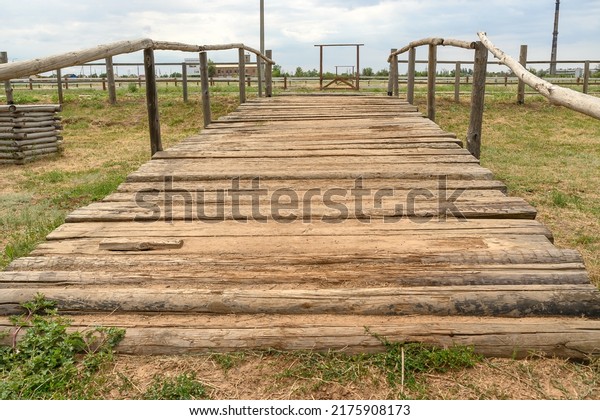 Decorative wooden bridge in nature in summer. For\
holidays and events. Close\
plan.