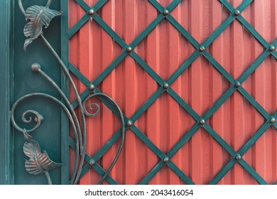 Decorative wrought iron gate with a red plate, metal gate