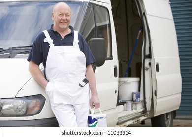 Decorator Standing Next To White Van - Powered by Shutterstock