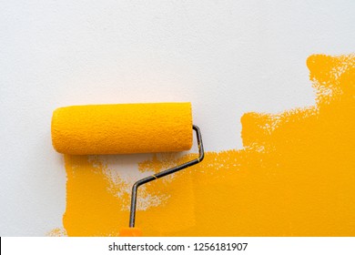 Decorator's hand painting wall by the roller brush for protection and corrosion,Set of tools for painting wall at home