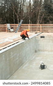 Dedicated Construction Worker Actively Engaged in the Comprehensive Pool Building Process