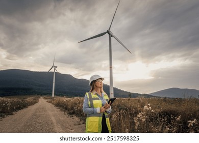 A dedicated female engineer is actively managing wind turbines as part of a significant renewable energy project aimed at promoting sustainable practices and innovative technology solutions - Powered by Shutterstock