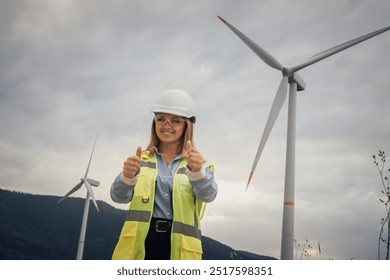 A dedicated Female Engineer at the Wind Farm celebrates advancements in Sustainable Energy, emphasizing the importance of teamwork and collaboration for a better ecofriendly future - Powered by Shutterstock