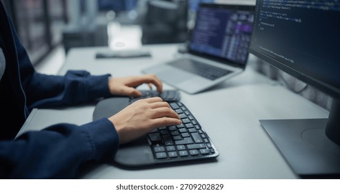 Dedicated Programmer Typing Code on Ergonomic Keyboard in a Tech Office. Engaged in Software Development, Modern Technology for Innovative Solutions and Efficient Digital Transformation.