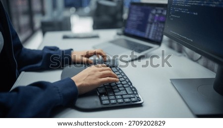 Dedicated Programmer Typing Code on Ergonomic Keyboard in a Tech Office. Engaged in Software Development, Modern Technology for Innovative Solutions and Efficient Digital Transformation.