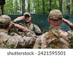 A dedicated soldier salutes his elite unit, showcasing camaraderie and readiness for the most perilous military operations