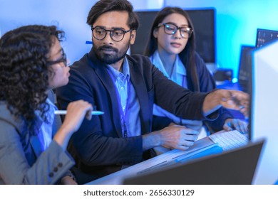 A dedicated IT team collaborates in a command center, working on a critical software deployment or incident response. Concept for system implementation, teamwork, and operations.