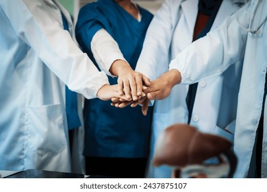 A dedicated team of doctors and healthcare professionals working collaboratively in a hospital setting, ensuring quality patient care with expertise and compassion. - Powered by Shutterstock