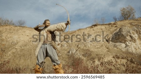A dedicated Warrior Hunter navigating the expansive Wilderness with his trusty Bow and Arrow