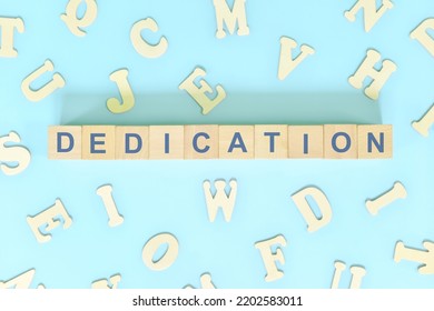 Dedication Part Of A Book Concept. Wooden Blocks Typography Word Flat Lay In Blue Background.	