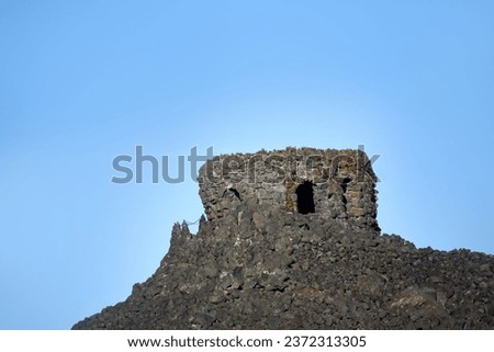 Dee Wright Observatory sits at the top of a lava field on the McKenzie Pass, in Central Oregon.  Doorway allows vistors to enter and enjoy panoramic views of lava field.