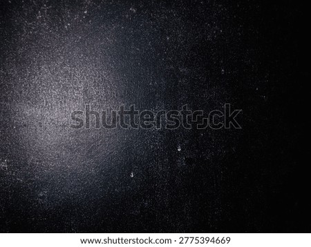 Deep black background with soft light, elegant and modern backdrop. 
