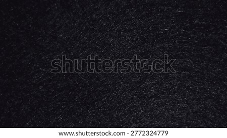 a deep black textured bacgrpund with subtle grain and soft matte finish, Creating a minimalis and elegant visual tone
