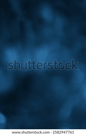 A deep blue abstract texture featuring soft blur and gradient. The image evokes a sense of calm and elegance.