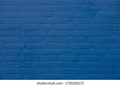 Deep blue painted on brick wall, Outdoor building, Abstract geometric pattern background, Outdoor old building brick block texture, Can be used as background for display or montage your products.