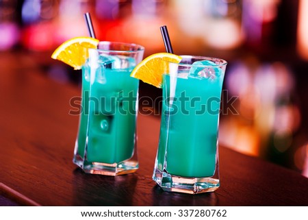 Deep Blue Sea cocktails on a bar. Tilted view.