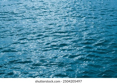 Deep blue sea texture background. Background of aqua sea water surface. Blue sea surface. Aqua water surface. Blue ocean water texture background. Surface of sea.