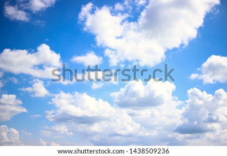 Deep blue skies with white clouds background with space for text,  blue cloudy skies texture, dark blue sky wallpaper with with white fully clouds and sunlight