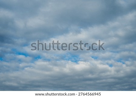 a deep blue sky covered in a rhythmic, undulating pattern of white altocumulus clouds, creating a dense atmospheric texture across the balkan horizon