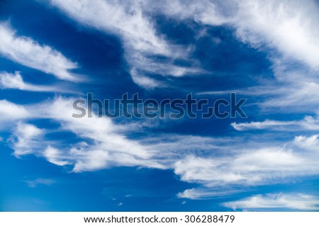 Deep blue sky with picturesque stratus clouds