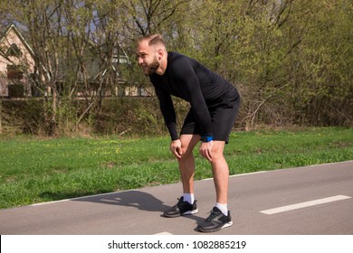 Deep Breathing After Running! Handsome Bearded Fit Young Man Tired A Little Bit And Breathing, While Taking Break After Morning Efficient Training.