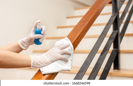 Deep cleaning for Covid-19 disease prevention. alcohol,disinfectant spray on Wipes of Banister in home for safety,infection of Covid-19 virus,contamination,germs,bacteria that are frequently touched . - Shutterstock ID 1668246598