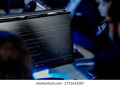 Deep code focus. Developers working late debugging software script visible on screen collaborative coding session in progress intense tech teamwork dev life revealed.