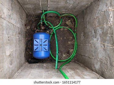 Deep Concrete Pit With A Water Pumping Station For Water Supply At House