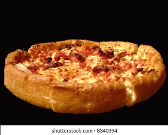 A Deep Dish Chicken. Onion, And Sun Dried Tomato Topped Pizza Isolated On Black Background. Clipping Path Included