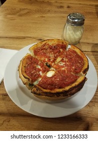 Deep Dish Pizza With Parmesan Cheese Shaker