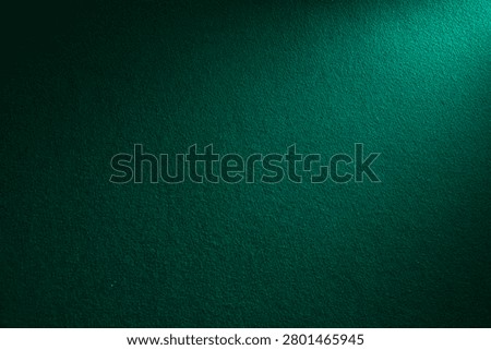 Deep Emerald Green Textured Abstract Background with Subtle Light Gradient and Copy Space
