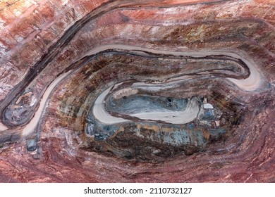 Deep Excavated Open Pit Copper Ore Mine In Cobar Town Of Outback Australia - Aerial Top Down View.