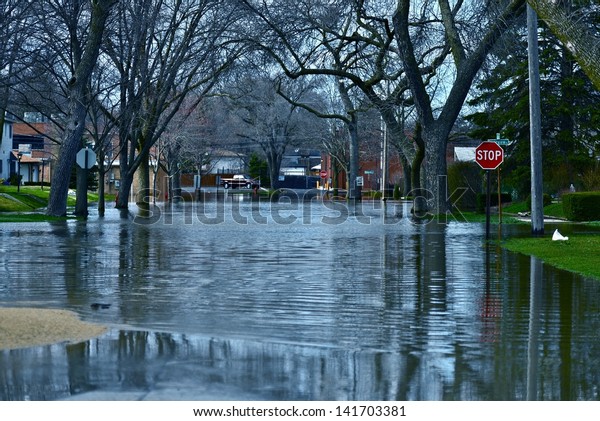 Deep Flood Water in Residential Area. Des\
Plains, IL, USA. City Under River Flood Water. Nature Disasters\
Photography Collection.