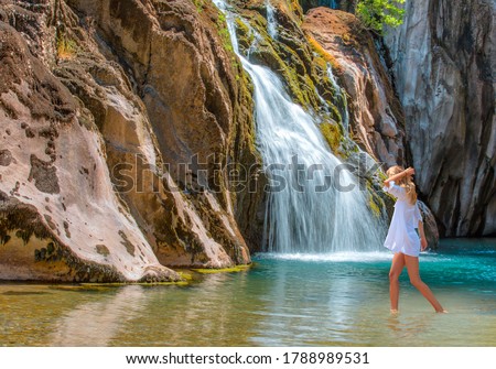 Deep forest Waterfall - Pebbles rocks underwater below Alara Ucansu waterfall with surface in shallow water - Antalya, Turkey