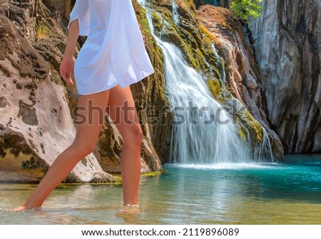 Deep forest Waterfall - Pebbles rocks underwater below Alara Ucansu waterfall with surface in shallow water - Antalya, Turkey