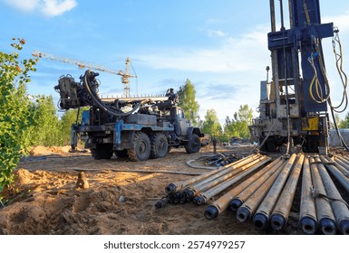 Deep foundation machine. Pile driver at construction site. Pile driven in ground by vibrating hydraulic hammer. Drilling rig crude oil. Groundwork Build. Soil Testing for Foundation Construction.