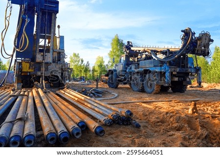 Deep foundation machine. Pile driver at construction site. Pile driven in ground by vibrating hydraulic hammer. Drilling rig crude oil. Groundwork Build. Soil Testing sewage. Water well drilling.