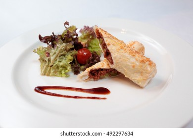 Deep fried beef rolled in egg wraper