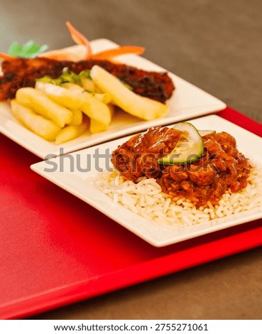 deep fried bone in beef short rib with thick cut potato chips and a rich oxtail stew served over white rice with cucumber.